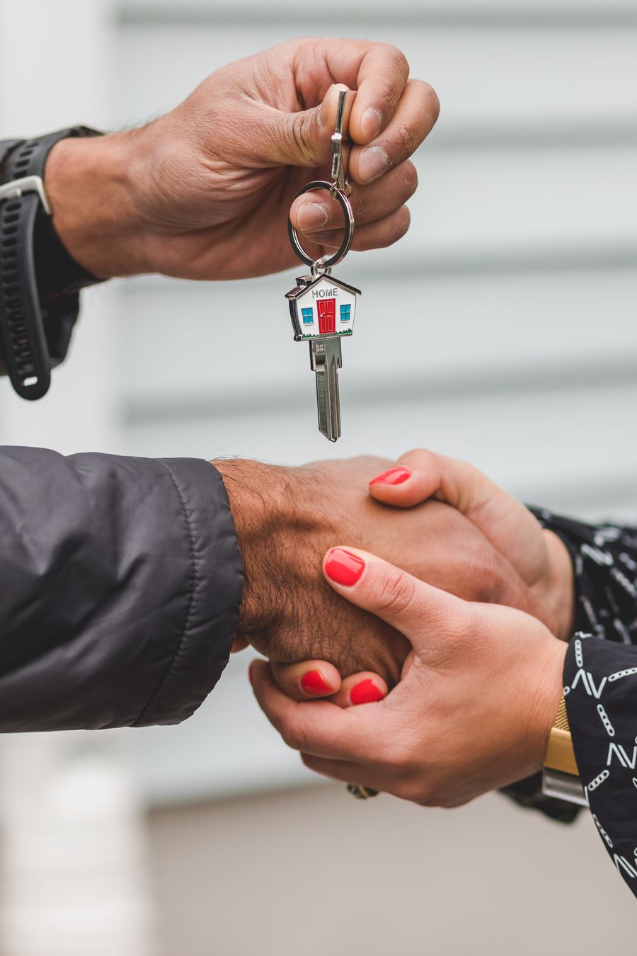 House key being handed over during a property handoff