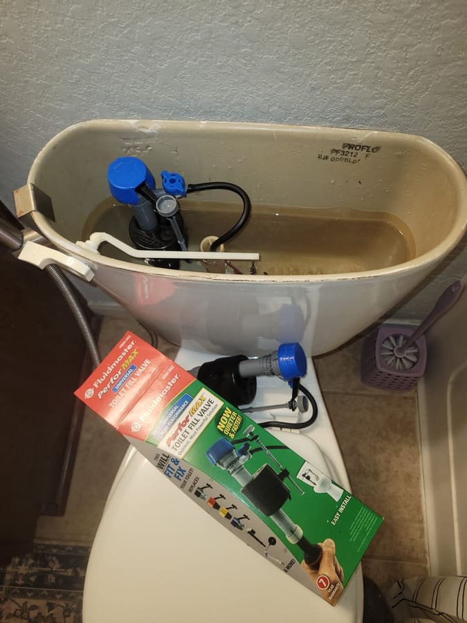 New fill valve installed in a toilet tank